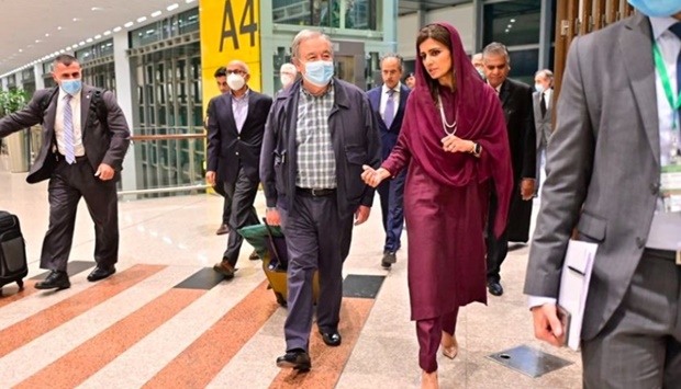 Antonio Guterres, United Nations Secretary General, walks with Pakistan's Minister of State for Foreign Affairs Hina Rabbani Khar, upon his arrival at the Islamabad International Airport in Islamabad, Pakistan September 9, 2022.