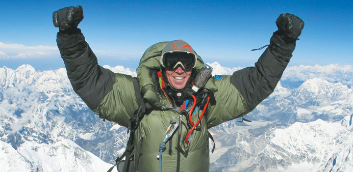 Adrian Ballinger celebrates as he summits Mount Everest for the sixth time on May 18, 2013.