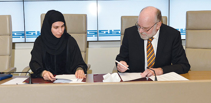  Dr Eiman Mustafawi and Dr John Hansen at the signing of the agreement.