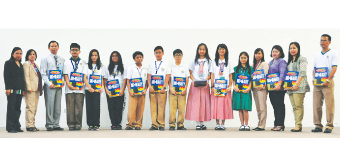 Alexander Acosta, teachers and students of the Philippine School of Doha receive copies of the book u2013 the final output for the literary and art contes