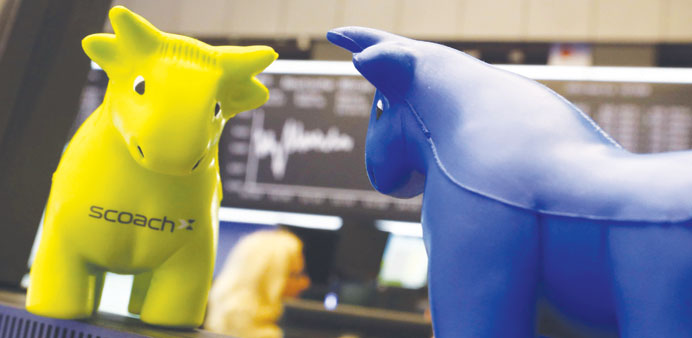 Small foam bull figures are seen in front of the DAX board at the stock exchange in Frankfurt. The DAX 30 rose 0.19% to 9,405.30 points to yet another