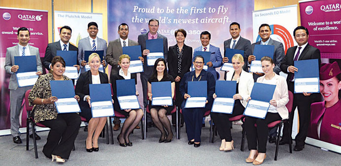Members of Qatar Airwaysu2019 Customer Experience Training Team display their certificates.