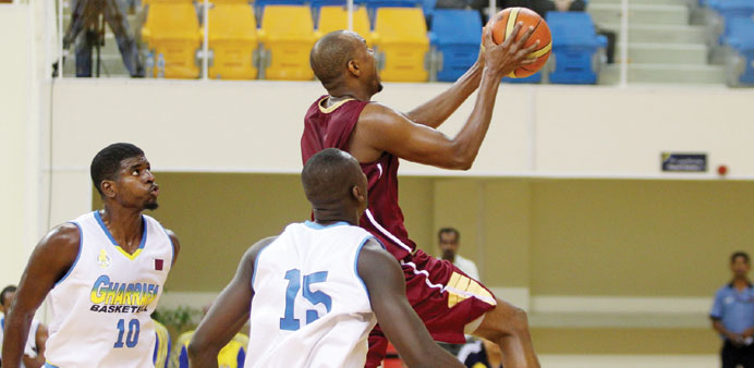 Action from the El Jaish-Al Gharafa match in the Qatar Basketball League yesterday. El Jaish won 87-84.