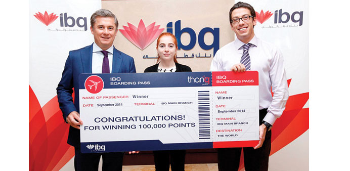 ibq officials with the official presentation u2018boarding passu2019 for the September winner of the u2018thanqu2019 loyalty programme.