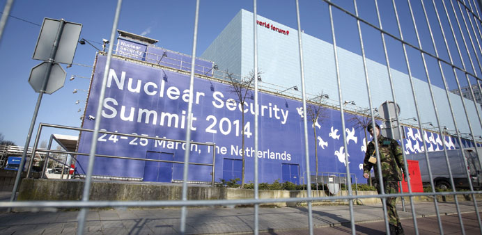 A soldier patrols the World Forum, the location of the Nuclear Security Summit (NSS), in The Hague.