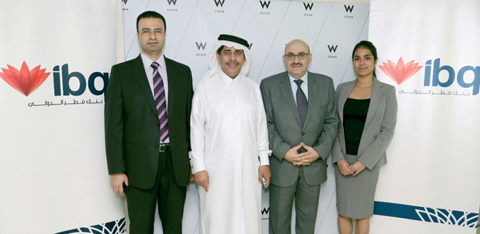 Officials of ibq and W Doha Hotel & Residences.