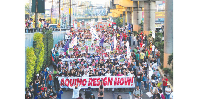 Militant groups from various organisations march along Edsa during the 29th anniversary of the People Power revolt on Wednesday, to press for the pres