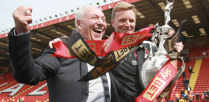 Bournemouth chairman Jeff Mostyn celebrates winning the Championship with manager Eddie Howe.