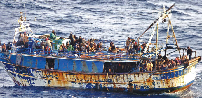 A handout picture released by the Hellenic Coast Guard yesterday and taken on Monday shows immigrants on a boat at sea off the Greek island of Crete.