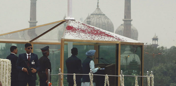 Prime Minister Manmohan Singh addresses the nation from a bullet-proof enclosure at the historic Red Fort during independence day celebrations in Delh