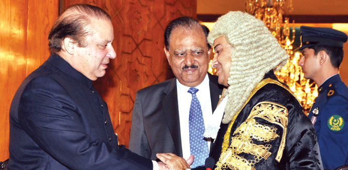 Prime Minister Nawaz Sharif greets newly appointed Chief Justice, Justice Nasir-ul- Mulk after the oath-taking ceremony at the Aiwan-e-Sadr in Islamab