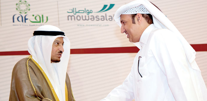HE Dr al-Khulaifi and al-Hammadi greeting each other at the conference.