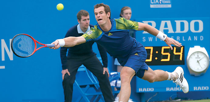 Britain's Andy Murray hits a return to France's Nicolas Mahut at the Aegon Championships in London yesterday. (Reuters)