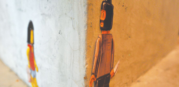 This illustration shows an immitation paper cut-out of a street mural originally created by Lithuanian artist Ernest Zacharevic displayed at a restaur