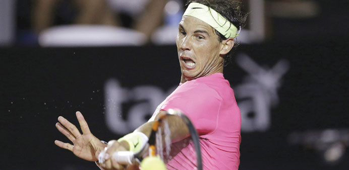 Rafael Nadal of Spain returns to Pablo Cuevas of Uruguay during their quarter-final clash at the Rio Open. (Reuters)