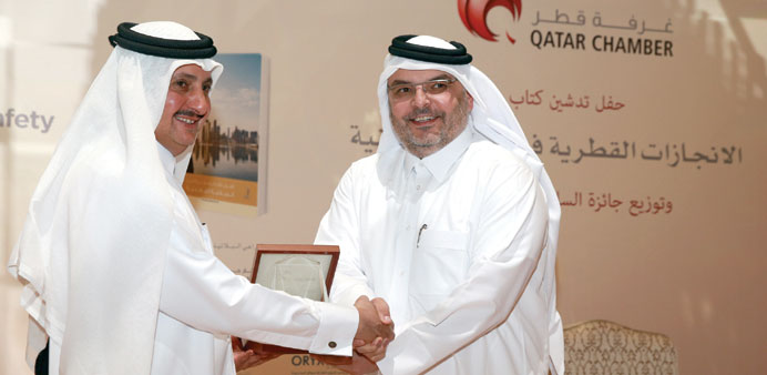 Sheikh Khalifa presenting the award to Qatar Rail CEO Saad Ahmed al-Mohannadi at the event yesterday.