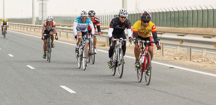 Riders wearing colourful jerseys take part in a road race. PICTURE: Pinoy Roadies Qatar