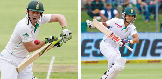 South Africau2019s JP Duminy (right) and AB de Villiers in action during the second day of the second Test against Australia in Port Elizabeth yesterday. 