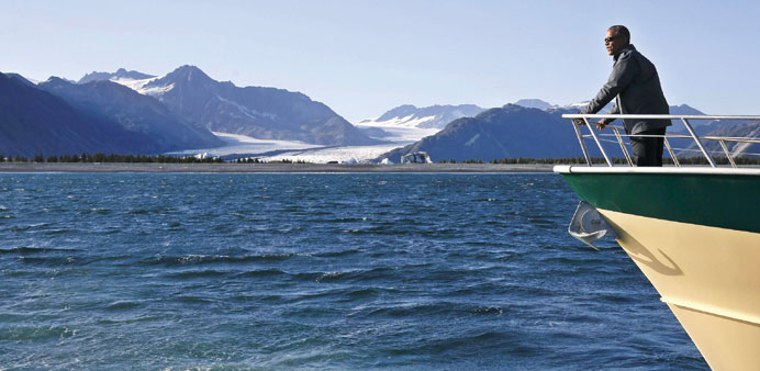 President Barack Obama views Bear Glacier on a boat tour of Kenai Fjords National Park in Seward, Alaska on Tuesday.