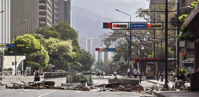 A barricade by demonstrators blocks a street in Caracas, Venezuela, yesterday. 
