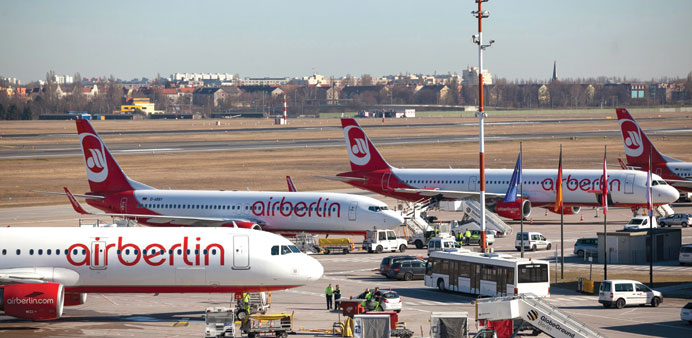    Air Berlin aircraft sit on the tarmac at Tegel airport in Berlin. Etihad Airways is raising its s