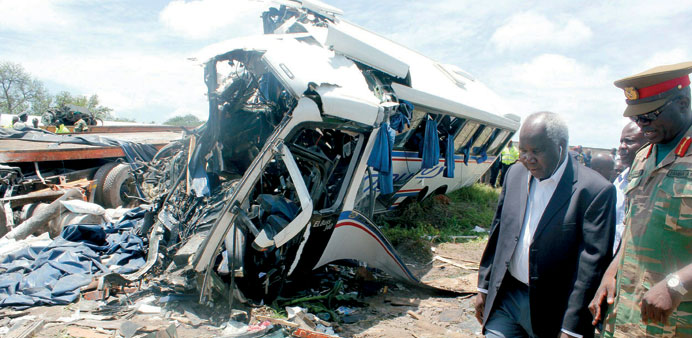 Zambian deputy minister for Works and Supply, Colonel Panji Kaunda, and a Provincial Army representative inspects the accident scene in Chibombo yeste