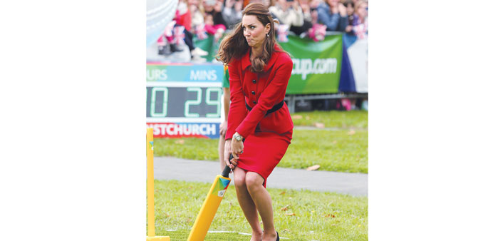 Catherine, the Duchess of Cambridge, plays cricket during a visit to Latimer Square in Christchurch yesterday.