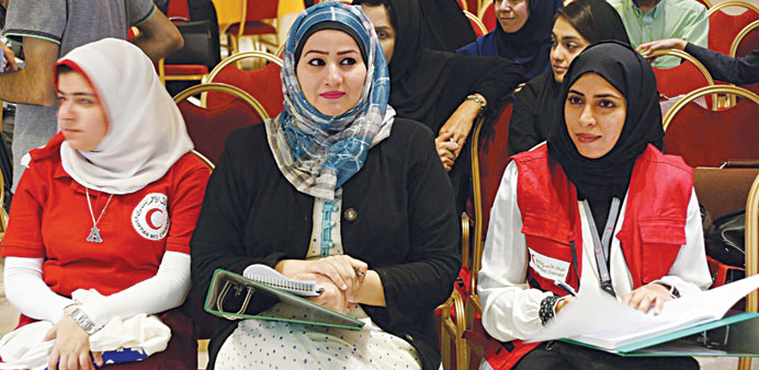 QRC representative Reema al-Merekhi (right) attending a session.