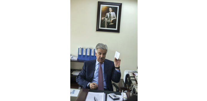 Khawaja Asif gesturing as he speaks during an interview with Reuters at his office in Islamabad.