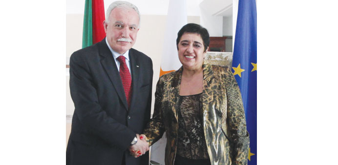 Cypriot Foreign Minister Erato Kozakou-Marcoullis welcomes her Palestinian counterpart Riyad al-Maliki during their meeting in Nicosia yesterday.