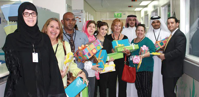 Sidra staff, holding Eid gifts at one of the hospitals.  