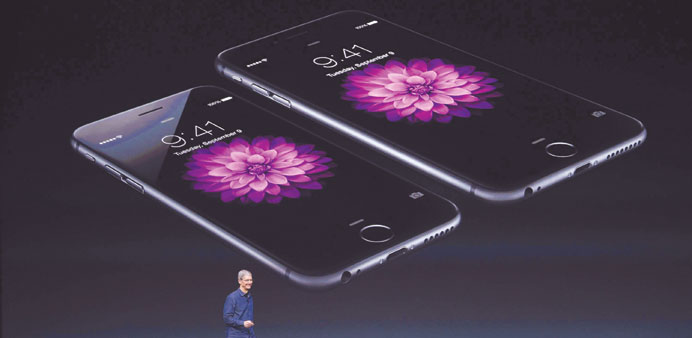 Apple CEO Tim Cook discussing the new iPhone 6 during a presentation in Cupertino, California.