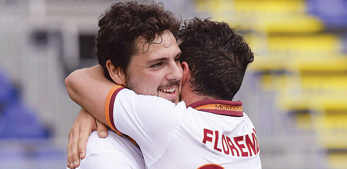 AS Romau2019s Mattia Destro (left) celebrates his goal with team-mate Alessandro Florenzi during their Serie A match against Cagliari yesterday. (EPA)