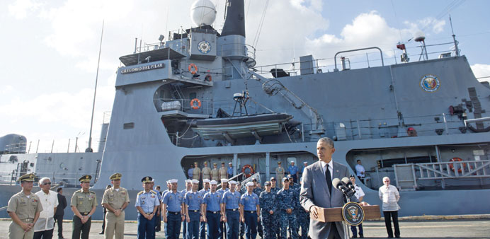 US President Barack Obama speaks following a tour of the BRP Gregario Del Pilar in the Manila Harbour yesterday, after arriving to attend the Asia-Pac