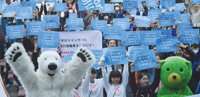 Environmentalists and participants in Tokyo, Japan, Dhaka, Bangladesh, Nantes, France and Geneva, Switzerland take part in rallies as part of the Glob
