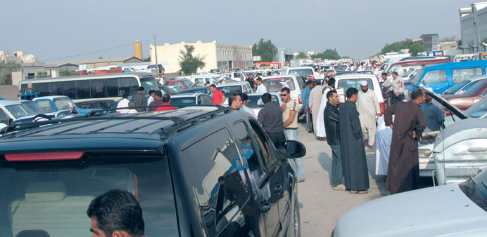 Prospective buyers at the weekend used car market in the Industrial Area.