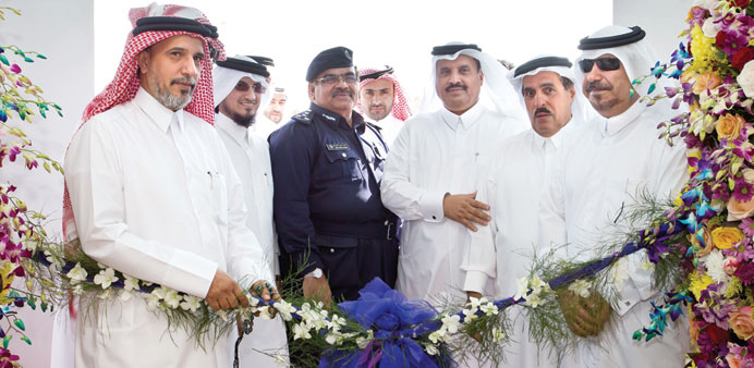 Mohamed Khalifa Turki al-Sobai with senior MoI officials and Woqod and QP executives during the opening of a new service station in North Mesaieed rec