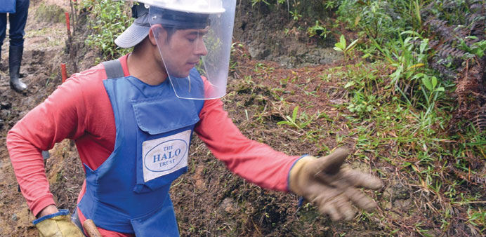 A worker with the HALO Trust looking for landmines near Sonson, Colombia.