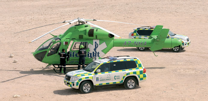 A LifeFlight  helicopter and a newly-introduced Toyota Land Cruiser GX ambulance in action at the Mushara desert area yesterday. PICTURE: Shemeer Rash