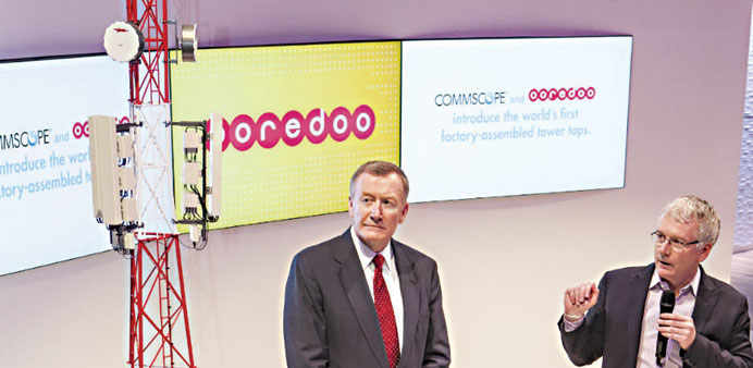 Paul Salmon (right) and Randy Crenshaw, CommScope executive vice president and chief operating officer, present the new factory-assembled network Towe