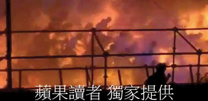 Silhouettes of people running from a blaze are seen at the Formosa Fun Coast water park in this still image taken from video shot on Saturday and prov