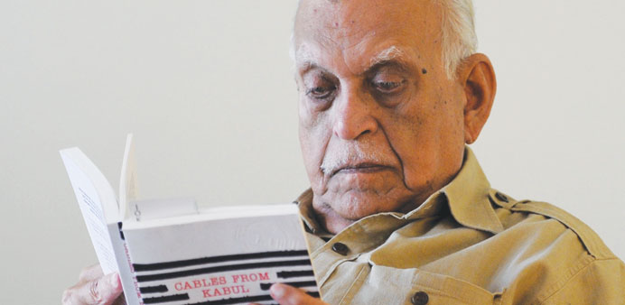 In this photograph taken on October 11, 2011, Jamil Ahmad reads a book at his home in Islamabad.