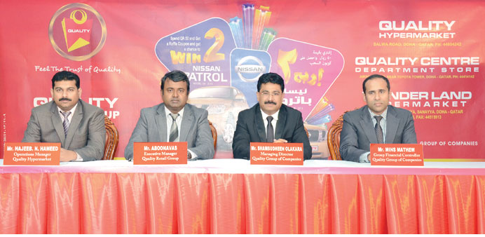 Quality Retail Group officials announcing sales promotion yesterday.