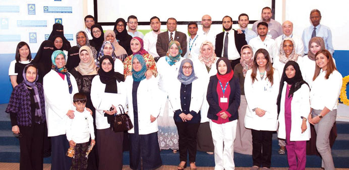 Dr Manal Zaidan with staff members during the celebration.