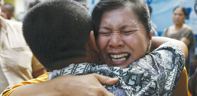 A woman after she found that her brother was among the victims.