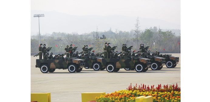 Soldiers ride tanks during a parade to mark the 70th anniversary of Armed Forces Day in Myanmaru2019s capital Naypyidaw yesterday.