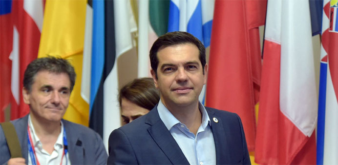 Greece's Prime Minister Alexis Tsipras and Greek Finance Minister Euclid Tsakalotos (L) 