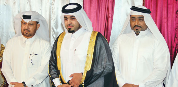 The groom Turki flanked by his brother and QCu2019s Matawah (left).