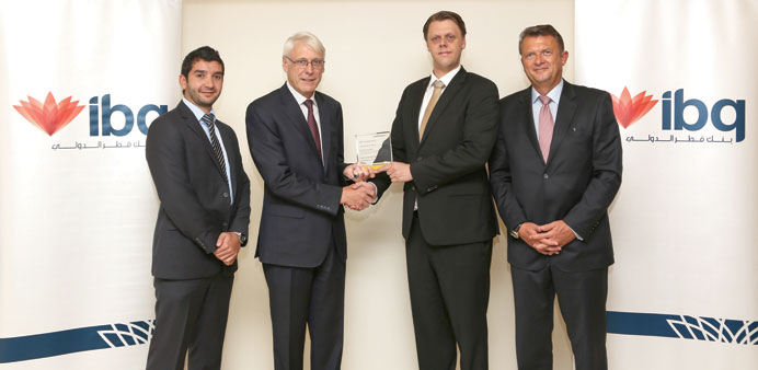 ibq and Commerzbank officials at a ceremony.