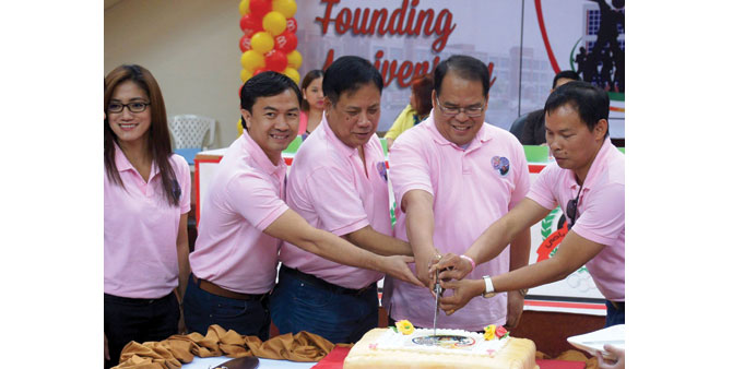 CAKE-CUTTING: The cake cutting ceremony was led by Philippine Ambassador Wilfredo Santos.